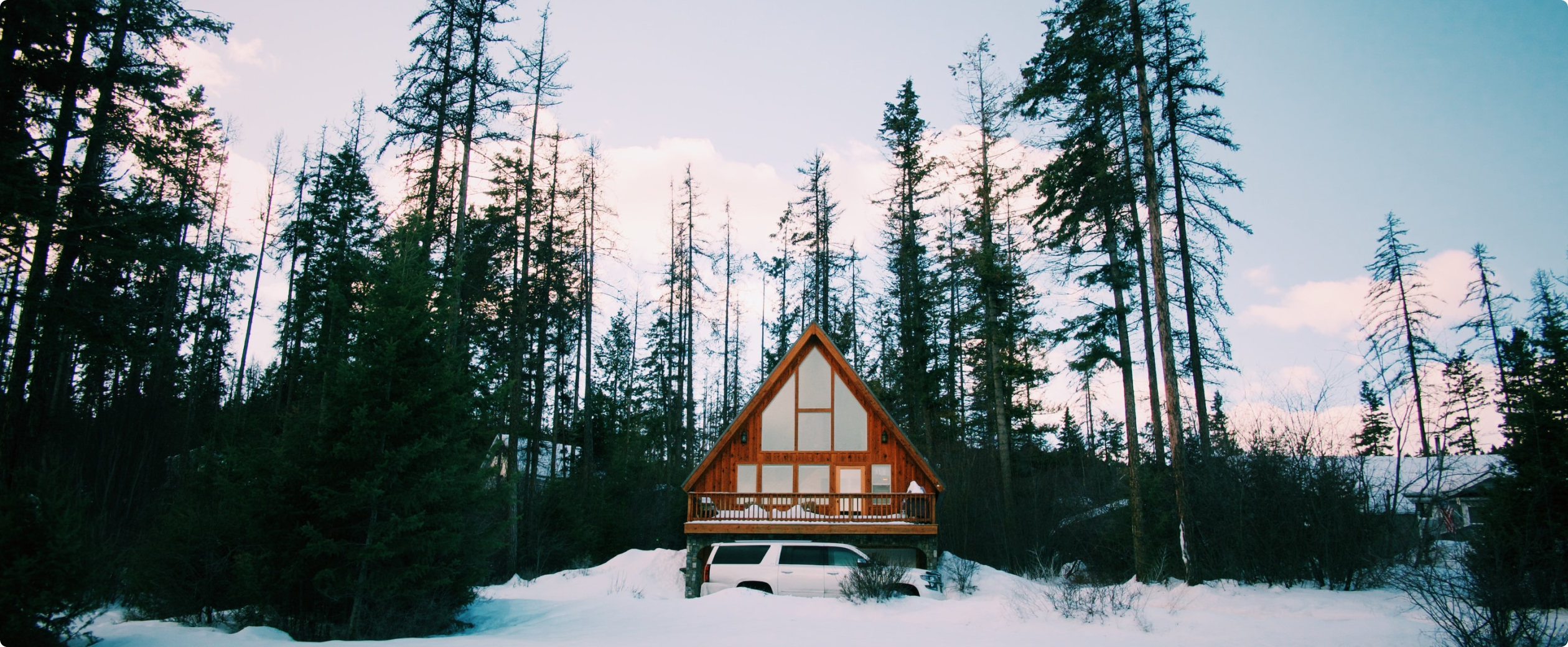 Hero image of cabin in snow
